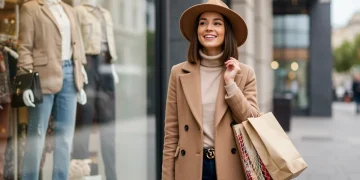 Stylish woman confidently showcasing designer-inspired outfit on a budget